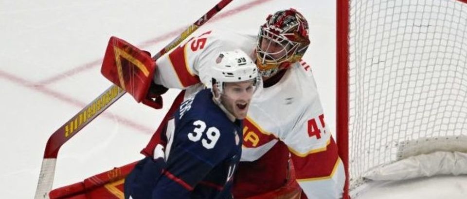 USA's Ben Meyers celebrates after teammate Sean Farrell (out of frame) scored a goal against China during the men's preliminary round group A match of the Beijing 2022 Winter Olympic Games ice hockey competition, at the National Indoor Stadium in Beijing on February 10, 2022. (Photo by ANTHONY WALLACE/AFP via Getty Images)