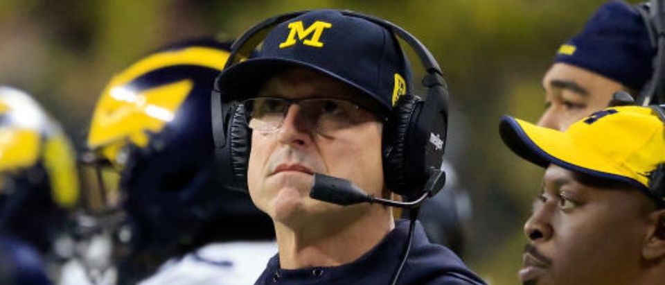 INDIANAPOLIS, INDIANA - DECEMBER 04: Head coach Jim Harbaugh of the Michigan Wolverines looks on during the first quarter against the Iowa Hawkeyes during the Big Ten Championship at Lucas Oil Stadium on December 04, 2021 in Indianapolis, Indiana. (Photo by Justin Casterline/Getty Images)