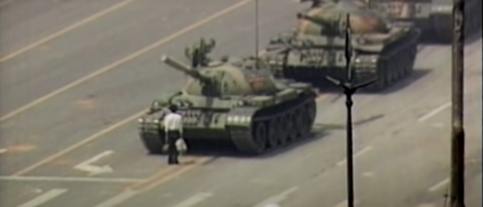 The Tank Man defies a column of PLA tanks headed for Tiananmen Square on June 5, 1989. [YouTube/Screenshot/FrontlinePBS]