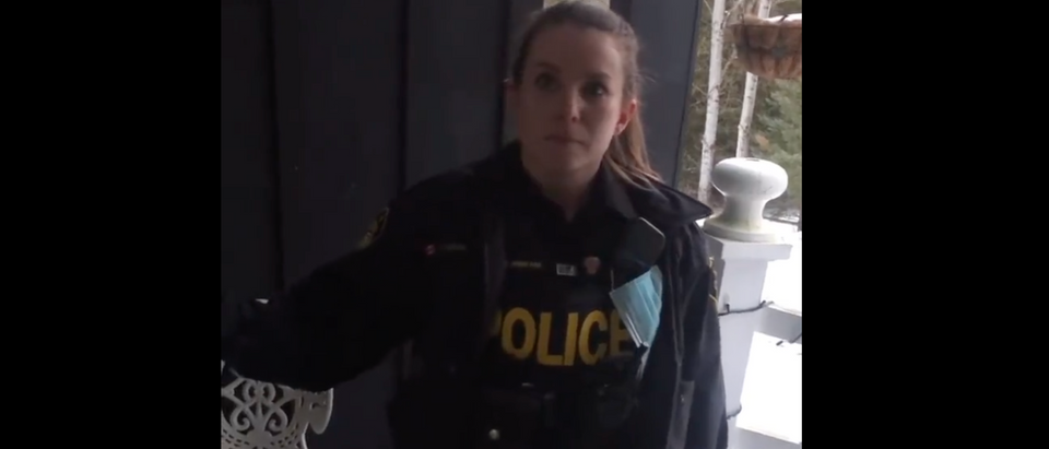 An OPP officer allegedly visited the home of a Canadian woman who interacted with a Facebook page in support of truckers [Twitter Screenshot Unacceptable Rowan]
