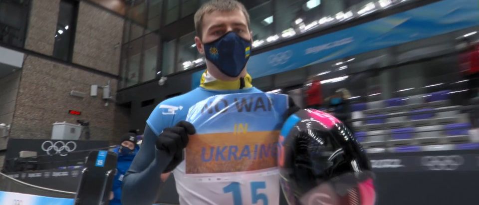 Olympian Displays Sign Calling For 'No War In Ukraine'