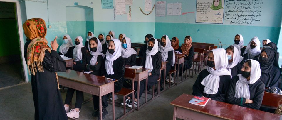 Girls attend a class after their school reopening in Kabul on March 23, 2022. (Photo by AHMAD SAHEL ARMAN/AFP via Getty Images)