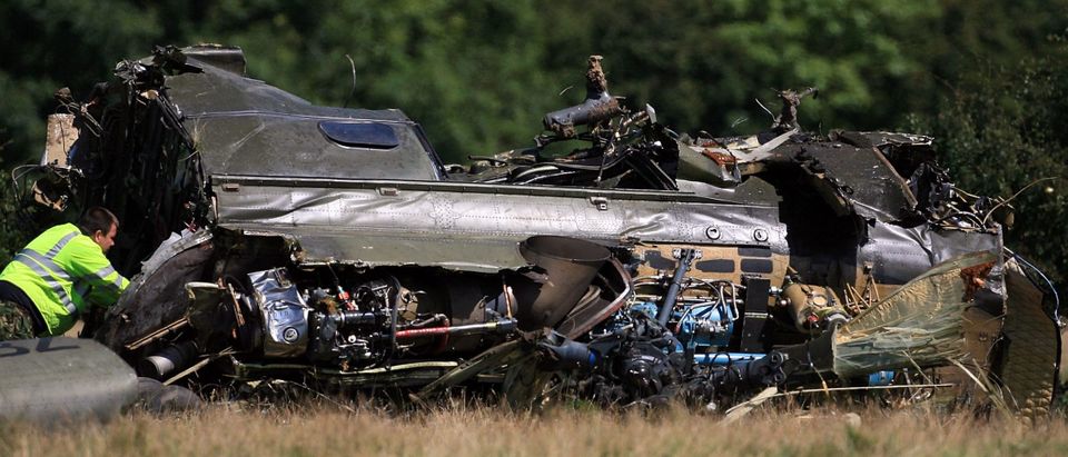 CATTERICK, ENGLAND - AUGUST 09: Royal Air Force personnel inspect the wreckage of a Puma helicopter which crashed the previous evening on Catterick Garrison training area, on August 9, 2007 near the village of Brokes, near Richmond, west of Catterick, North Yorkshire, England. The helicopter is believed to have been on an exercise when it crashed around 9pm last night. Two people died and ten people were injured; all believed to be military personnel. (Photo by Christopher Furlong/Getty Images)