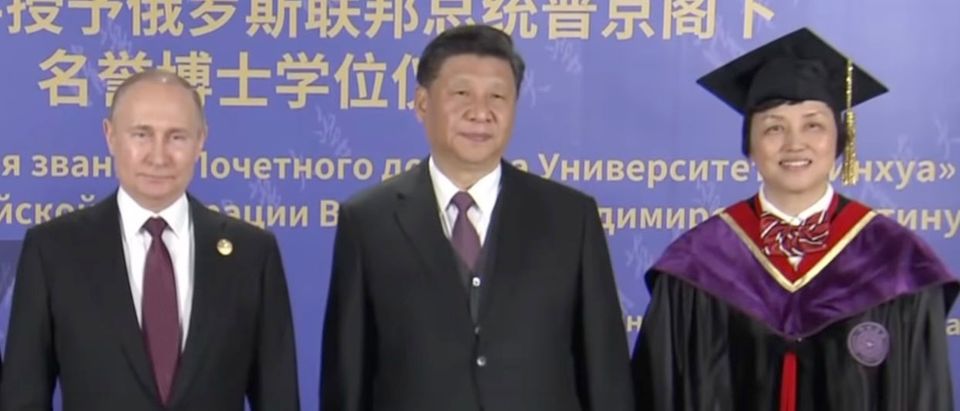 New deputy head of United Front Work Department, Chen Xu, delivered the keynote speech at the ceremony granting Russian President Vladimir Putin an honorary doctorate from Tsinghua University in April 2019 . [YouTube/Screenshot/Ruptly]