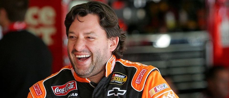 CONCORD, NC - OCTOBER 12: Tony Stewart, driver of the #20 The Home Depot Chevrolet, gets into his car in the garage during practice for the NASCAR Nextel Cup Series Bank of America 500 at Lowe's Motor Speedway on October 12, 2007 in Concord, North Carolina. (Photo by Streeter Lecka/Getty Images)