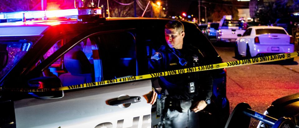 A Sacramento County Sheriff's Department officer looks on near the crime scene outside a church where a man shot dead four people, including three of his children, before turning the gun on himself, February 28, 2022 in Sacramento, California. - A father shot dead three of his own children on February 28 before turning the gun on himself in a US church, police said. A fifth person also died in the shooting in Sacramento, California, though it was not clear if that person was related to what police said was a domestic incident. (Photo by Andri Tambunan / AFP) (Photo by ANDRI TAMBUNAN/AFP via Getty Images)