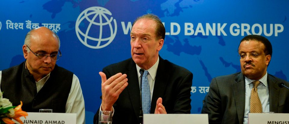 World Bank President David Malpass gestures as he speaks next to World Bank country Director for India Junaid Ahmad (L) and Regional Director for South Asia of International Finance Corporation (IFC) Mengistu Alemaheyu (R) during a press conference at the World Bank office in New Delhi on October 26, 2019. (Photo by Sajjad HUSSAIN / AFP) (Photo by SAJJAD HUSSAIN/AFP via Getty Images)