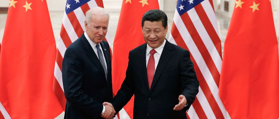 Chinese President Xi Jinping (R) shakes hands with U.S. Vice President Joe Biden (L) inside the Great Hall of the People in Beijing December 4, 2013. (REUTERS/Lintao Zhang/Pool)