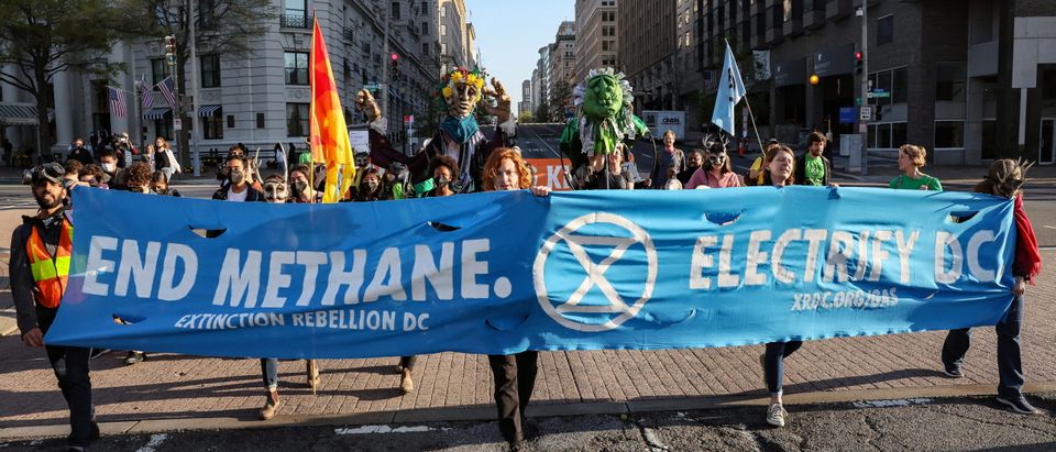 Activists from the climate group Extinction Rebellion demand an end to all new fossil fuel infrastructure in Washington on Earth Day