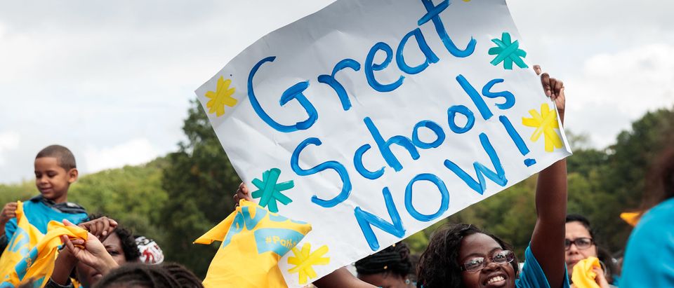 Parents, schoolchildren and education activists rally during an event supporting public charter schools and protesting New York's racial achievement gap in education. (Photo by Drew Angerer/Getty Images)