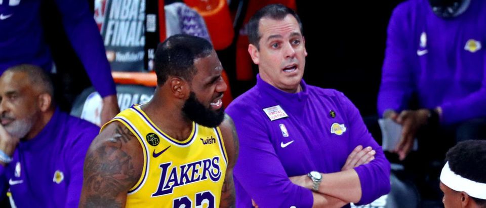 Sep 30, 2020; Orlando, Florida, USA; Los Angeles Lakers head coach Frank Vogel, forward LeBron James (23) and guard Rajon Rondo (9) talk with a referee during the third quarter against the Miami Heat in game one of the 2020 NBA Finals at AdventHealth Arena. Mandatory Credit: Kim Klement-USA TODAY Sports via Reuters