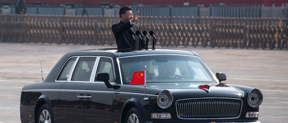 BEIJING, CHINA - OCTOBER 01: Chinese President Xi Jinping waves as he drives after inspecting the troops during a parade to celebrate the 70th Anniversary of the founding of the People's Republic of China at Tiananmen Square in 1949, on October 1, 2019 in Beijing, China. (Photo by Kevin Frayer/Getty Images)