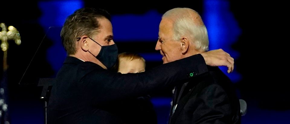 US President-elect Joe Biden (R) embraces his son Hunter Biden (L) on stage after delivering remarks in Wilmington, Delaware, on November 7, 2020. (Photo by Andrew Harnik / POOL / AFP) (Photo by ANDREW HARNIK/POOL/AFP via Getty Images)