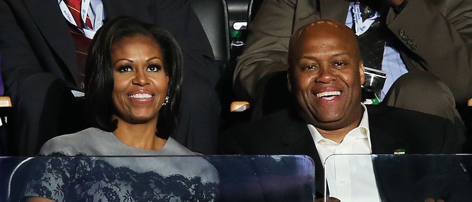 CHARLOTTE, NC - SEPTEMBER 05: First lady Michelle Obama sits with her brother Craig Robinson in a box during day two of the Democratic National Convention at Time Warner Cable Arena on September 5, 2012 in Charlotte, North Carolina. The DNC that will run through September 7, will nominate U.S. President Barack Obama as the Democratic presidential candidate. (Photo by Alex Wong/Getty Images)