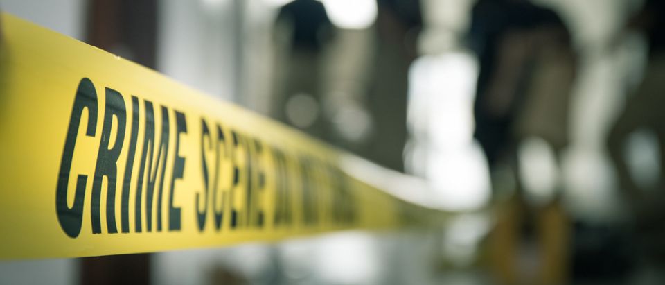 Crime,Scene,Tape,With,Blurred,Forensic,Law,Enforcement,Background,In