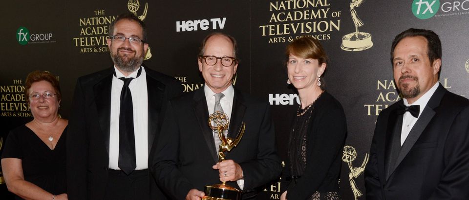 Producers of "Jeopardy!" pose backstage with the award for outstanding game show during the 41st Annual Daytime Emmy Awards in Beverly Hills