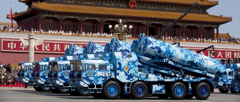 Military vehicles carry DF-10 ship-launched cruise missiles as they travel past Tiananmen Gate during a military parade to commemorate the 70th anniversary of the end of World War II in Beijing Thursday Sept. 3, 2015. (REUTERS/Andy Wong/Pool)