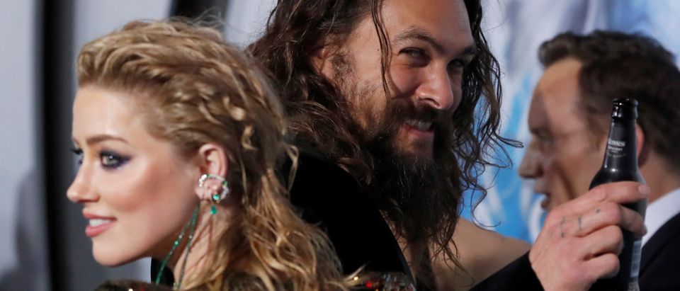 Cast members Momoa and Heard attend the premiere for "Aquaman" in Los Angeles