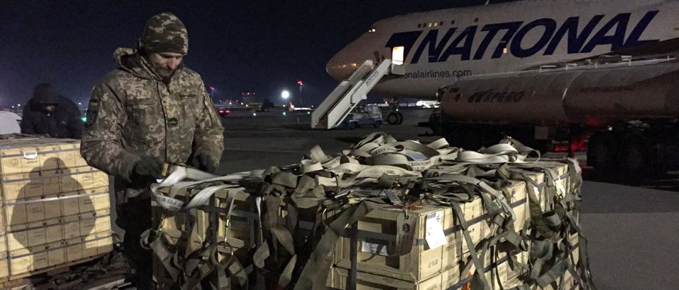 Military aid, delivered as part of the United States' security assistance to Ukraine, is unloaded from a plane at the Boryspil International Airport outside Kyiv, Ukraine February 13, 2022. REUTERS/Serhiy Takhmazov