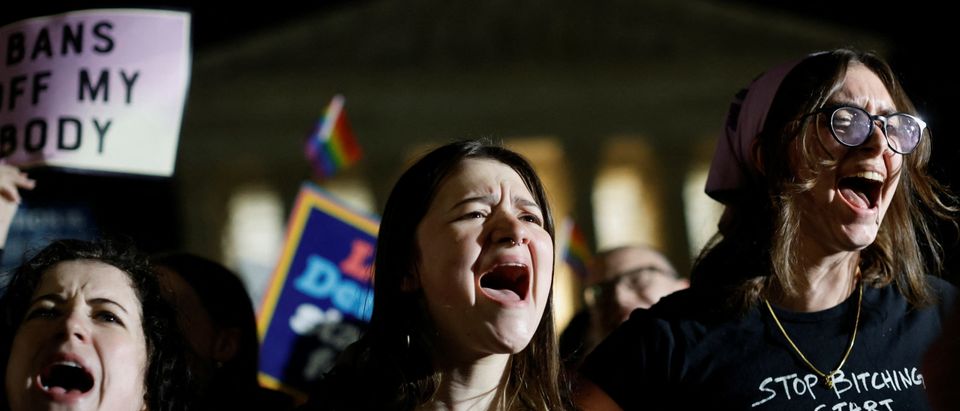 Protesters react outside the U.S. Supreme Court after the leak of a draft opinion preparing for a majority of the court to overturn the Roe v. Wade abortion rights decision in Washington