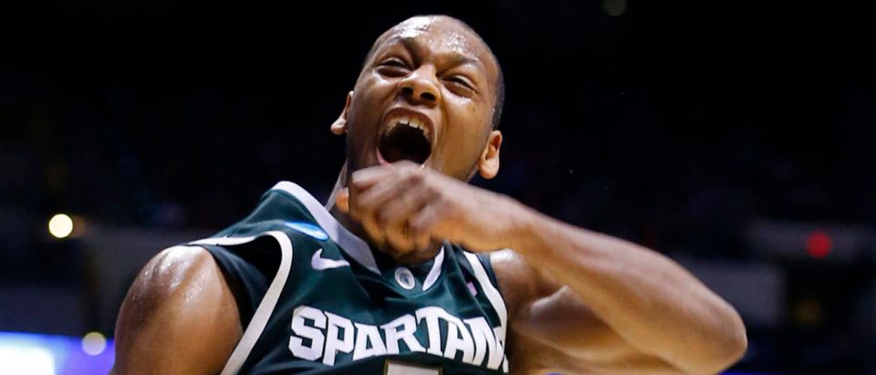 Michigan State Spartans forward Adreian Payne (5) celebrates a slam dunk against the Duke Blue Devils during their Midwest Regional NCAA men's basketball game in Indianapolis, Indiana, March 29, 2013. REUTERS/Jeff Haynes