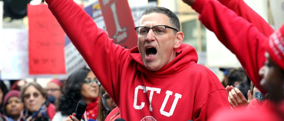 FILE PHOTO: Chicago Teachers Union President Jesse Sharkey cheers during a rally on the first day of a teacher strike in Chicago