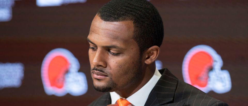 Mar 25, 2022; Berea, OH, USA; Cleveland Browns quarterback Deshaun Watson adjusts his tie during a press conference at the CrossCountry Mortgage Campus. Mandatory Credit: Ken Blaze-USA TODAY Sports via Reuters