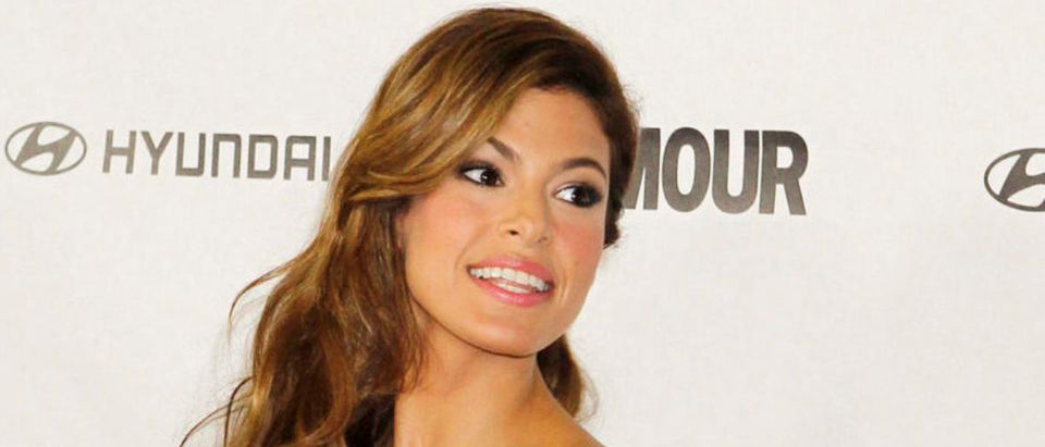 Actress Eva Mendes poses as she arrives for the Glamour Reel Moments event in Los Angeles, California October 25, 2010. The event showcases short films based on stories from "Glamour" magazine readers and features the directorial debut of actresses Jessica Biel, Mendes and Rachel Weisz. REUTERS/Fred Prouser