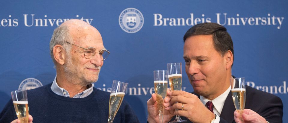 Brandeis Professor Michael Rosbash (L) shares a champagne toast with Brandeis University President Ron Liebowitz
