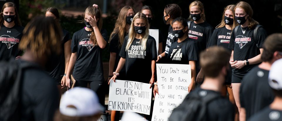 Members of the University of South Carolina womens soccer team join other student athletes during a demonstration against racial inequality and police brutality on August 31, 2020 in Columbia, South Carolina. The South Carolina football team organized the event in response to Jacob Blake, who was shot several times at close range in the back during an encounter with a Kenosha, Wisconsin police officer, which was caught on video. (Photo by Sean Rayford/Getty Images)