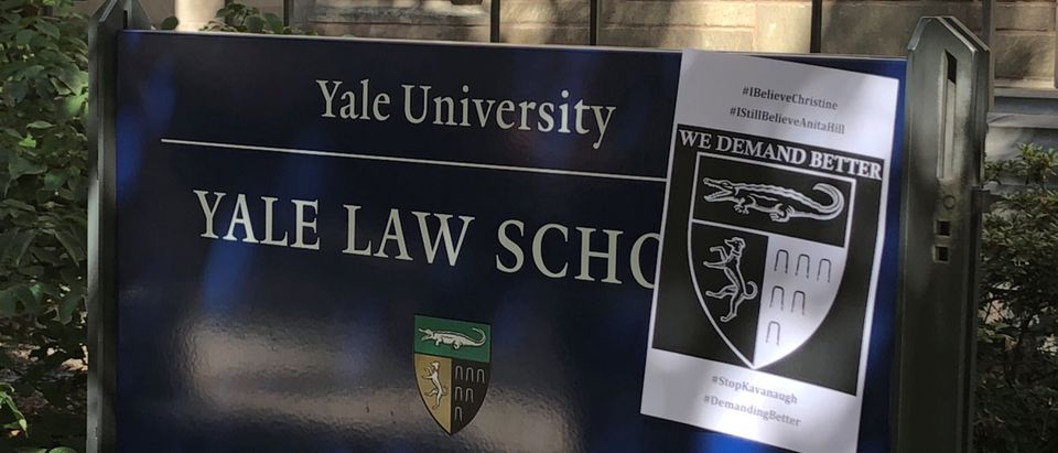 A poster in support of Christine Blasey Ford, who testified in front of a Senate Judiciary Committee hearing, hangs on a sign on the front lawn of Yale Law School in New Haven