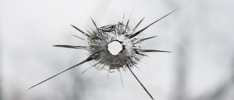 Broken window glass with bullet hole. This image does not depict the incident mentioned in-story[Shutterstock/Ingmari]