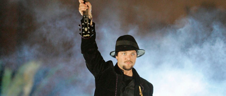 Bam Margera holds up a guitar before smashing it into a three-ton ice sculpture during taping for the opening of the VH1 Rock Honors Concert in Las Vegas