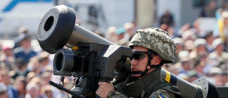 Ukrainian army servicemember rides with a Javelin anti-tank missile during a military parade marking Ukraine's Independence Day in Kiev