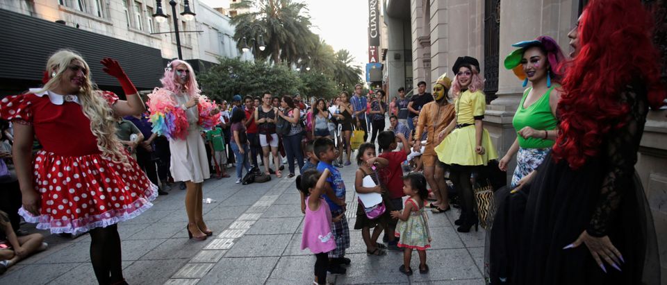 Participants dressed in drag dance along with children during the "Drag Queen Story Hour" event, which according to organizers involves participants reading stories to children for an hour, in downtown Monterrey