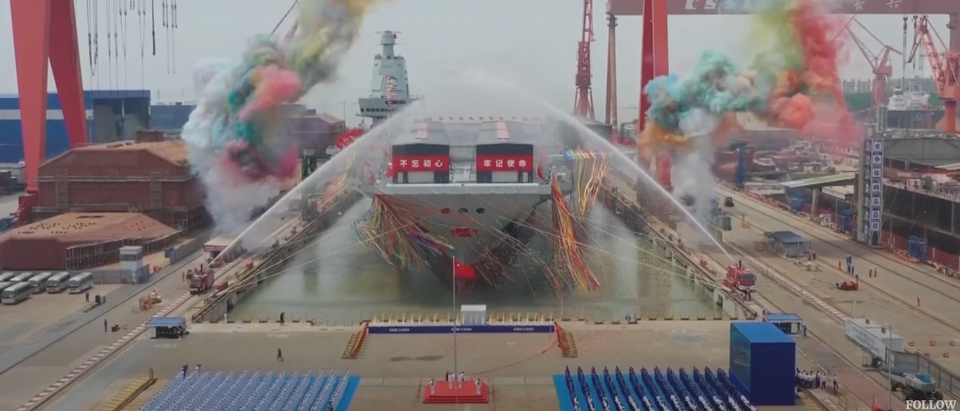 China unveiled its third aircraft carrier, Fujian, at its Shanghai harbor on Friday, according to Chinese state-run media. [Screenshot/YouTube/SouthChinaMorningPost]