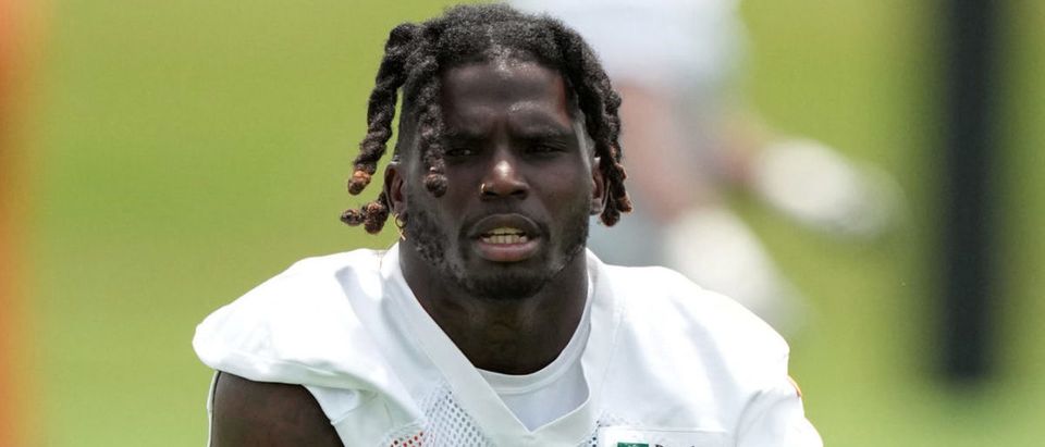 May 24, 2022; Miami Gardens, FL, USA; Miami Dolphins running back Tyreek Hill (10) stretches during OTA practice at Baptist Health Training Complex. Mandatory Credit: Jasen Vinlove-USA TODAY Sports via Reuters