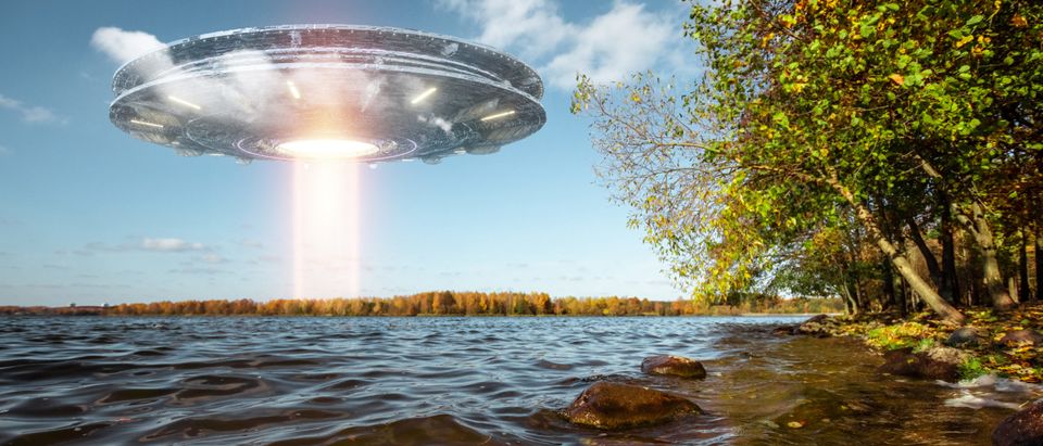 Ufo,,An,Alien,Plate,Hovering,Above,Water,,Hovering,Motionless,In