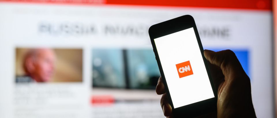 A smartphone with the CNN app [Shutterstock/ Nikita Burdenkov]