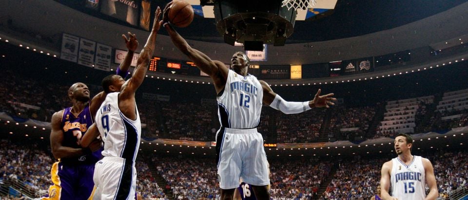 Magic's Dwight Howard grabs a rebound during Game 4 of their NBA Finals basketball game in Orlando