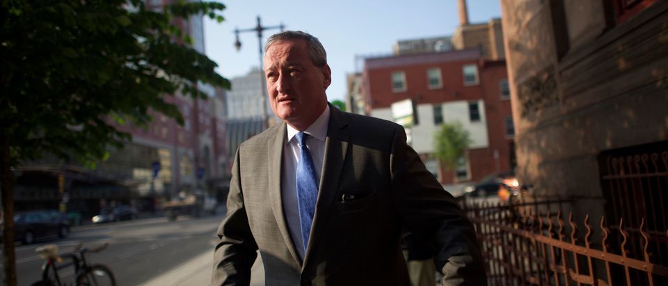 Philadelphia mayoral candidate Jim Kenney walks to greet supporters outside a senior center on primary election day in Philadelphia