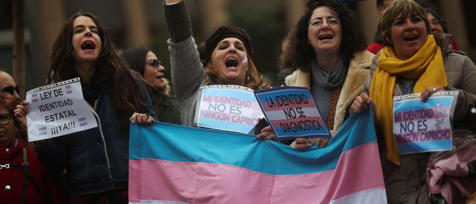 Supporters and families of transgender children take part in a protest against transphobia in Madrid