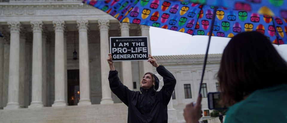 Pro-life protesters rally outside the U.S. Supreme Court waiting for the National Institute of Family and Life Advocates v. Becerra case which remains pending, in Washington, U.S., June 22, 2018.