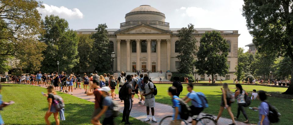 Students walk past Wilson Library on the campus of the University of North Carolina at Chapel Hill North Carolina
