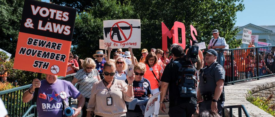 Members of Moms Demand Action and other gun control advocates hold a gun control rally in Richmond