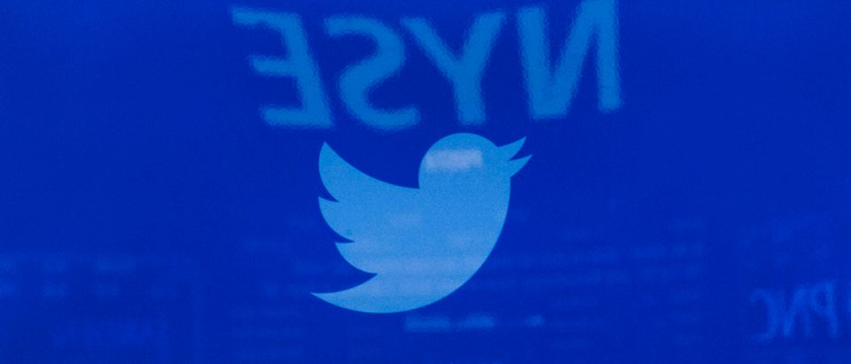 A screen displays the Twitter logo ahead of the company's IPO on the floor of the New York Stock Exchange