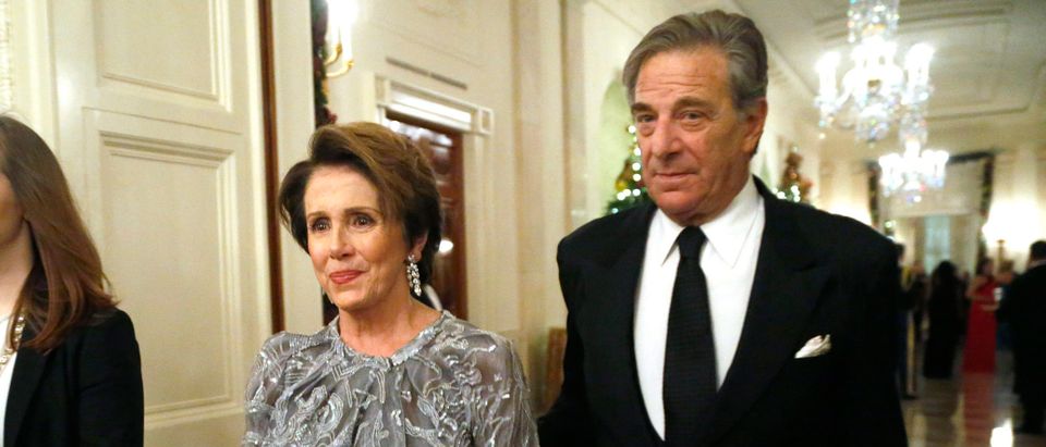 U.S. House Minority Leader Pelosi and her husband arrive for a reception for the Kennedy Center Honors recipients at the White House in Washington