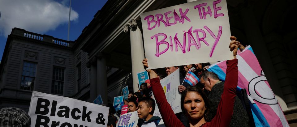 People rally to protest the Trump administration's reported transgender proposal to narrow the definition of gender to male or female at birth, in New York