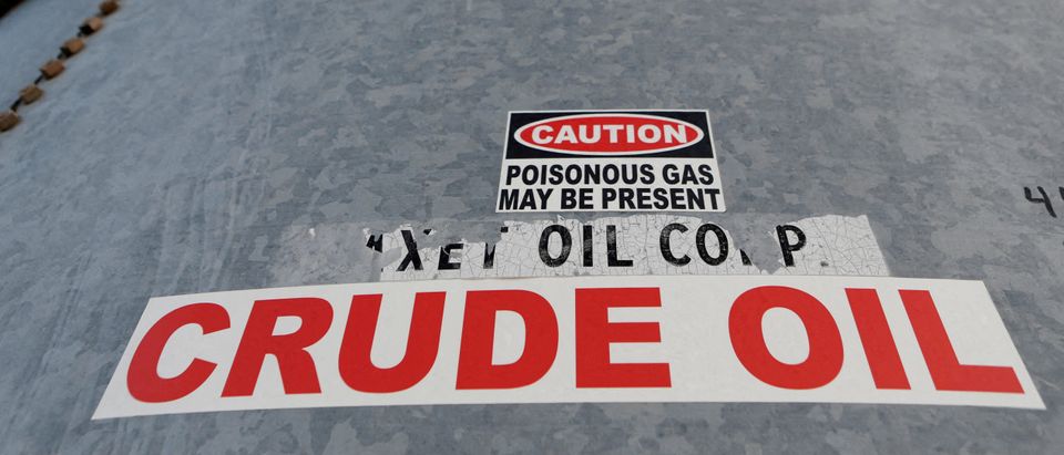 FILE PHOTO: A sticker reads crude oil on the side of a storage tank in the Permian Basin