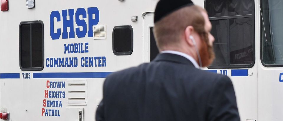 Orthodox Jew in front of security vehicle in New York